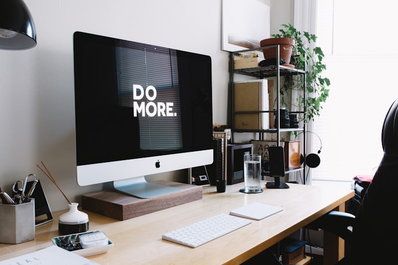 Minimal desk setup with laptop and coffee