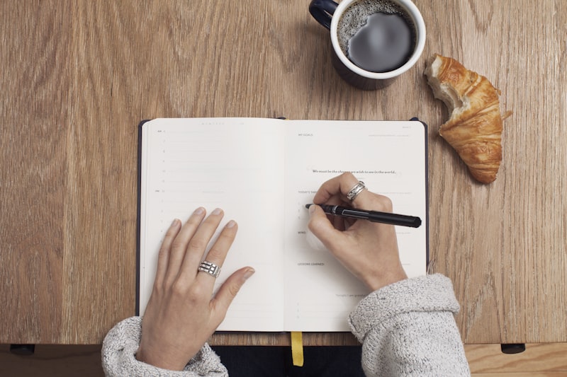 Planning in a journal with coffee